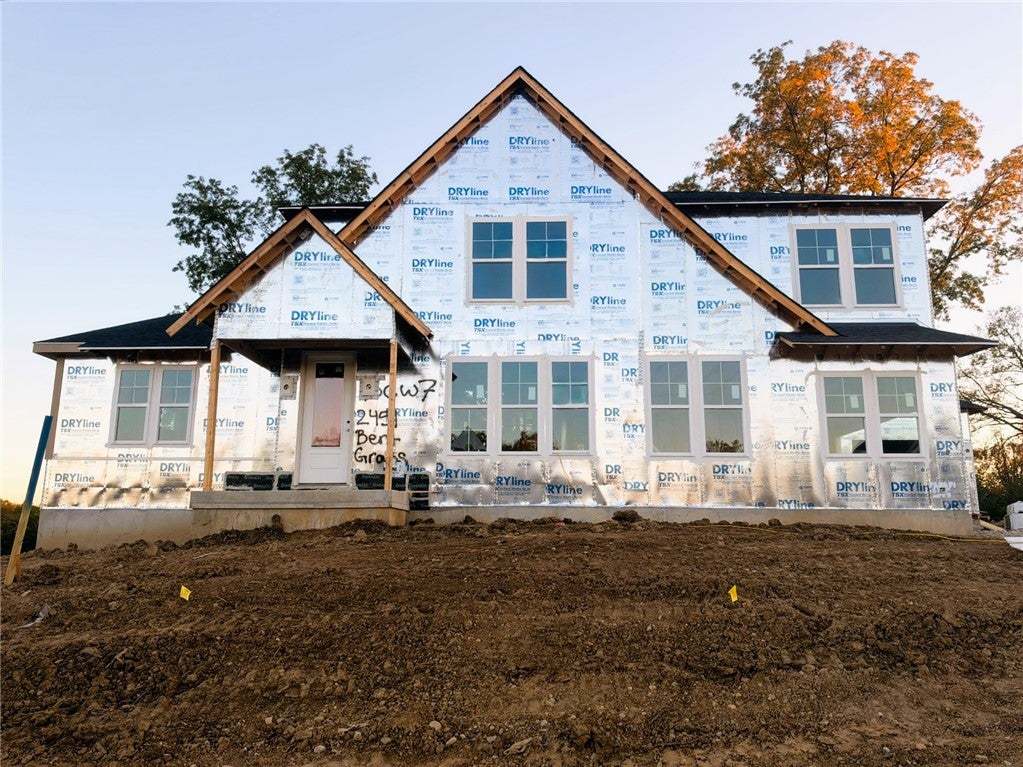 Clean architectural lines and multiple gables defi