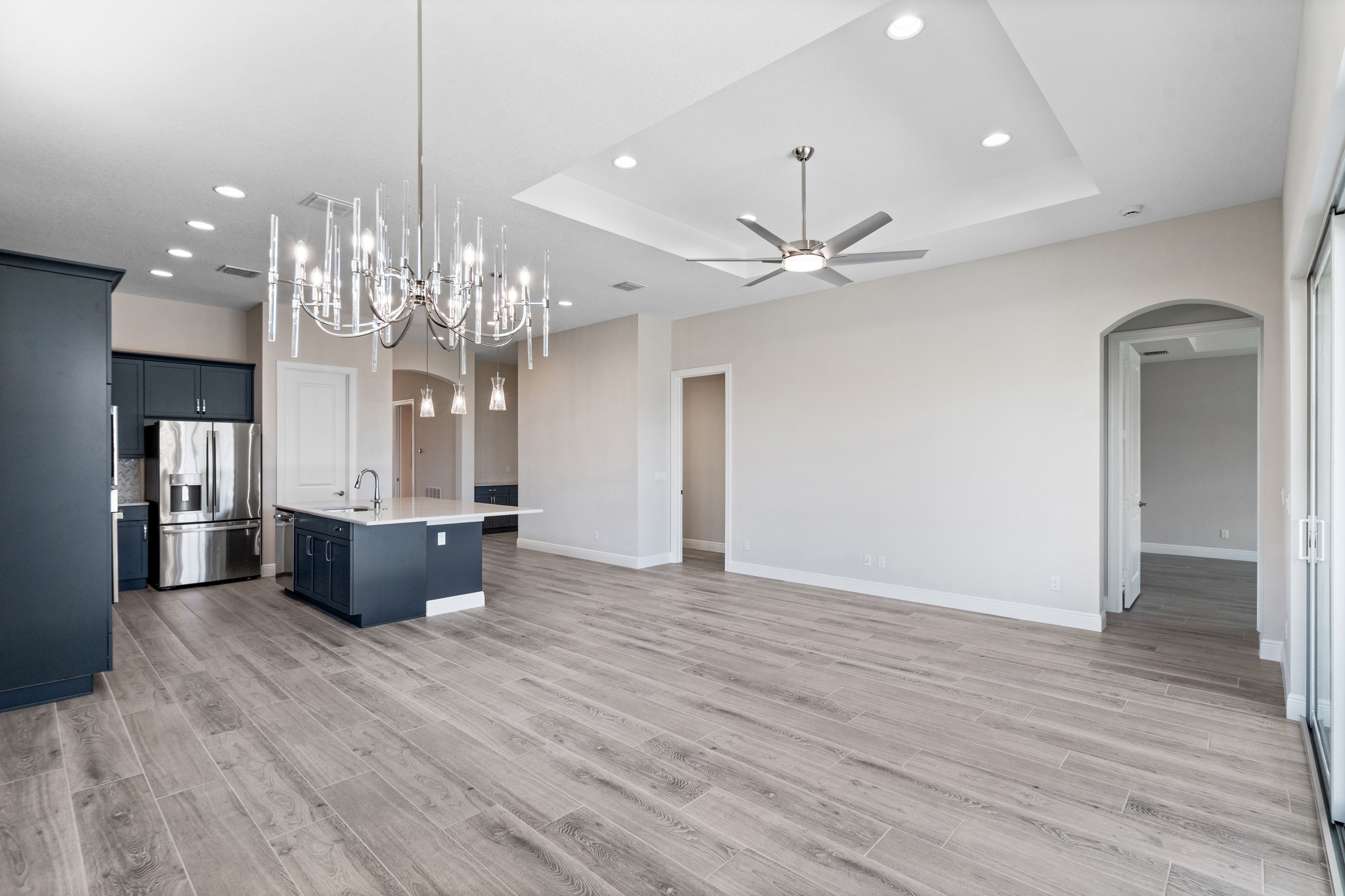 Dining to Great Room and Kitchen with Lights | 12501 SW Sunrise Lake Terrace