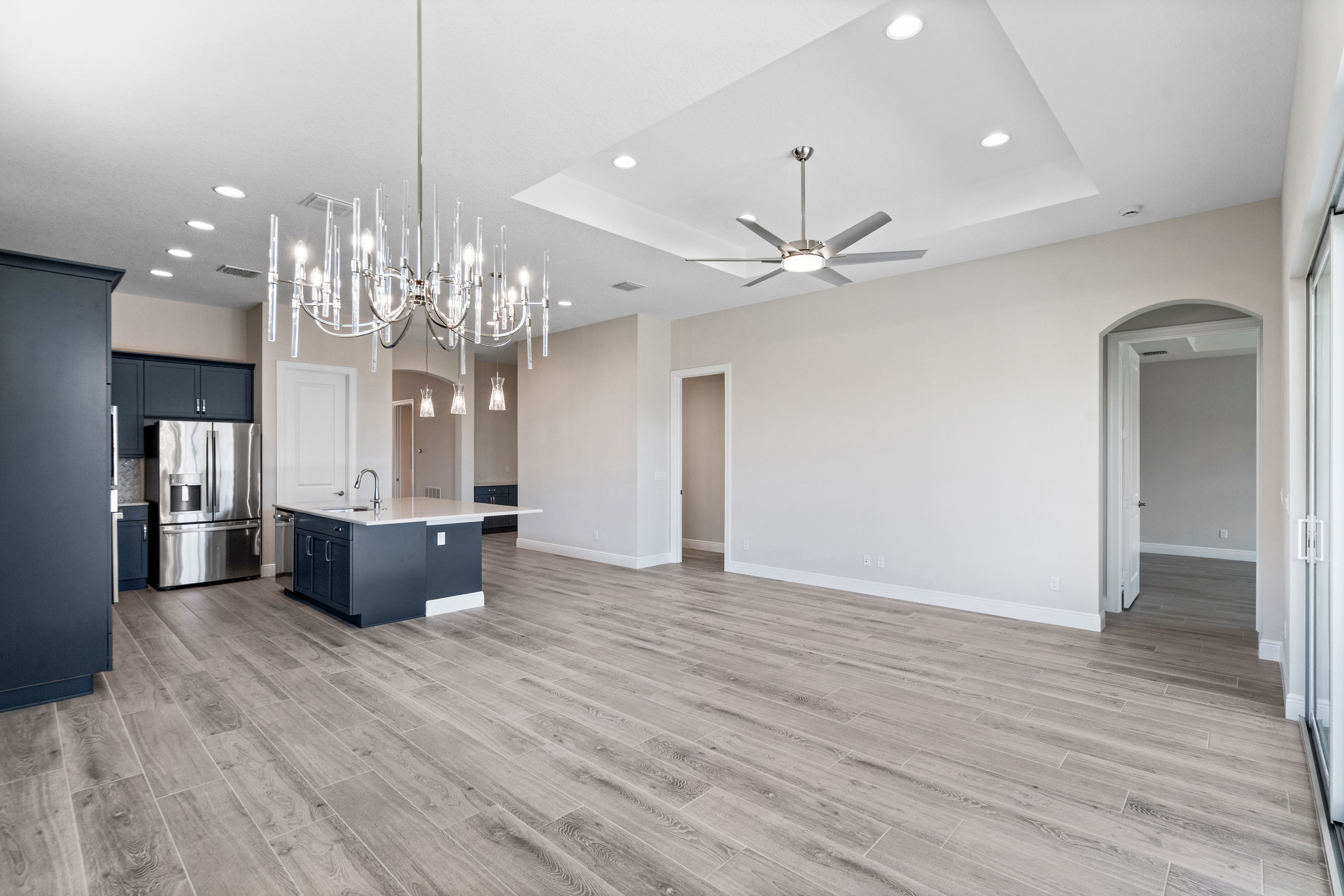 Dining to Great Room and Kitchen with Lights | 12501 SW Sunrise Lake Terrace