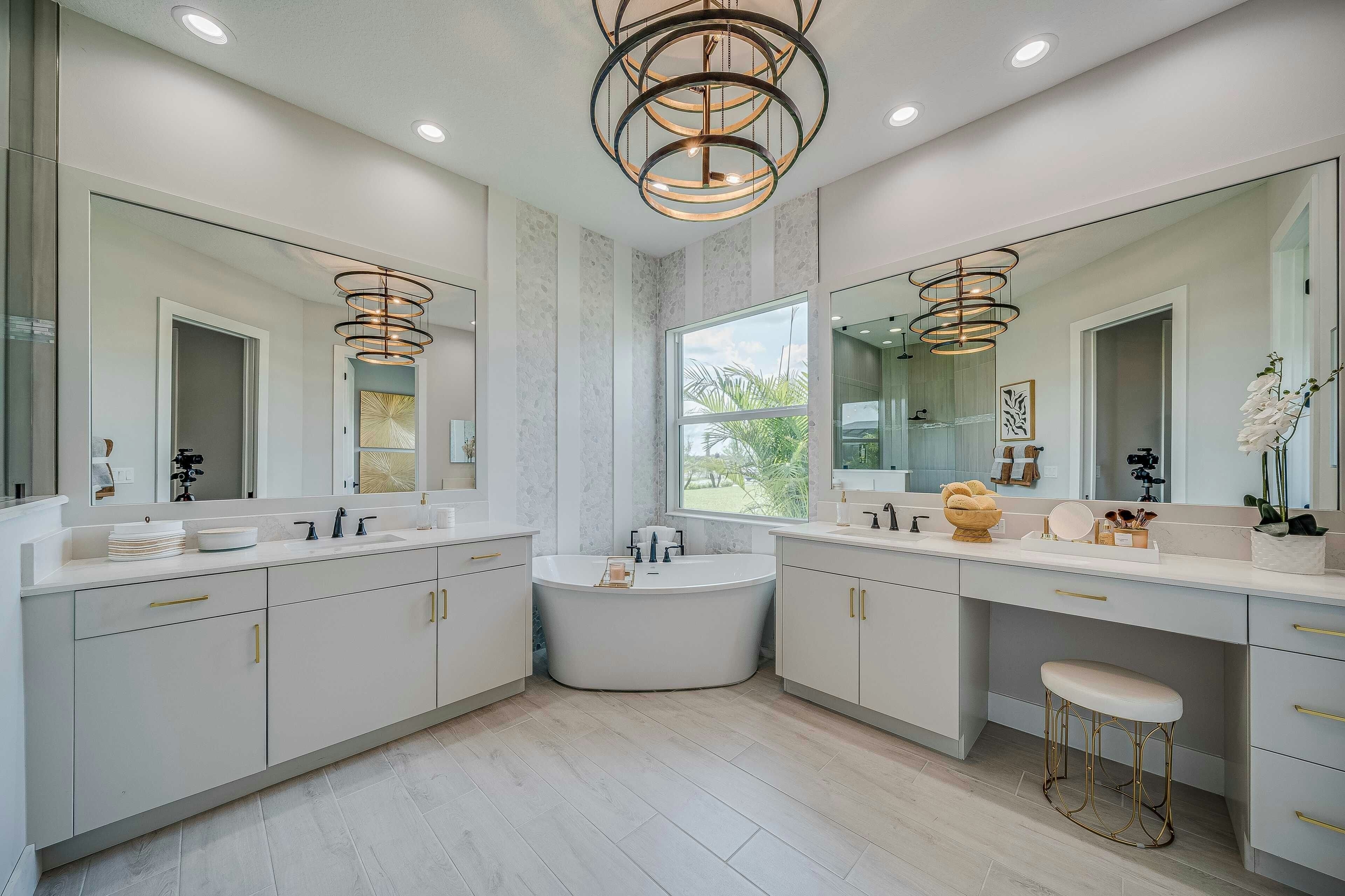 Master bath with wood tile floor, split vanity and corner soaking tub