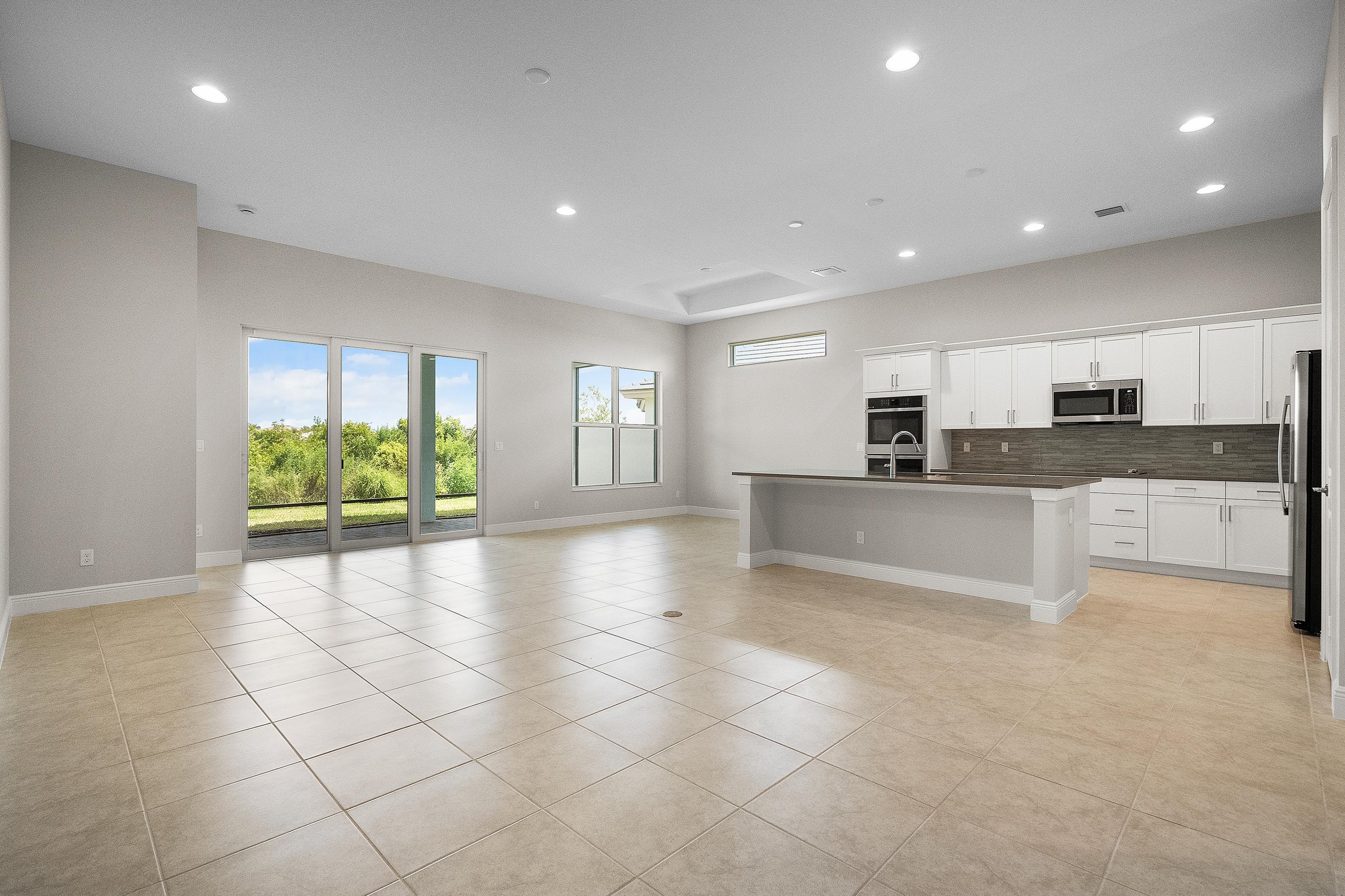 Great Room to Kitchen | 12507 SW Sunrise Lake Terrace