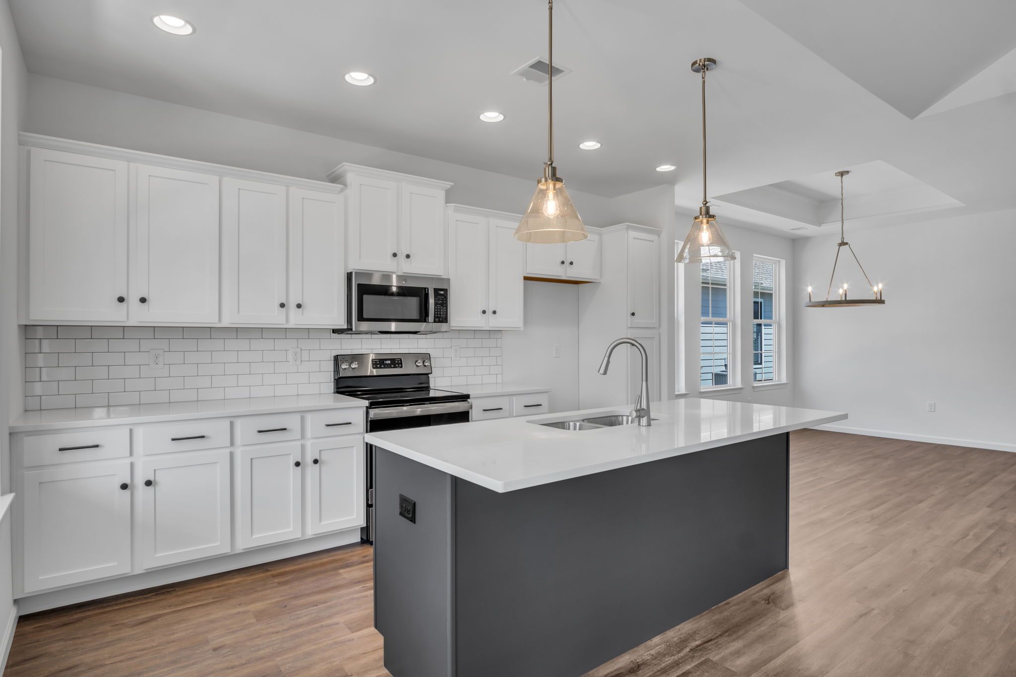 Kitchen with Center Island of the Tippet Model from Garman Builders