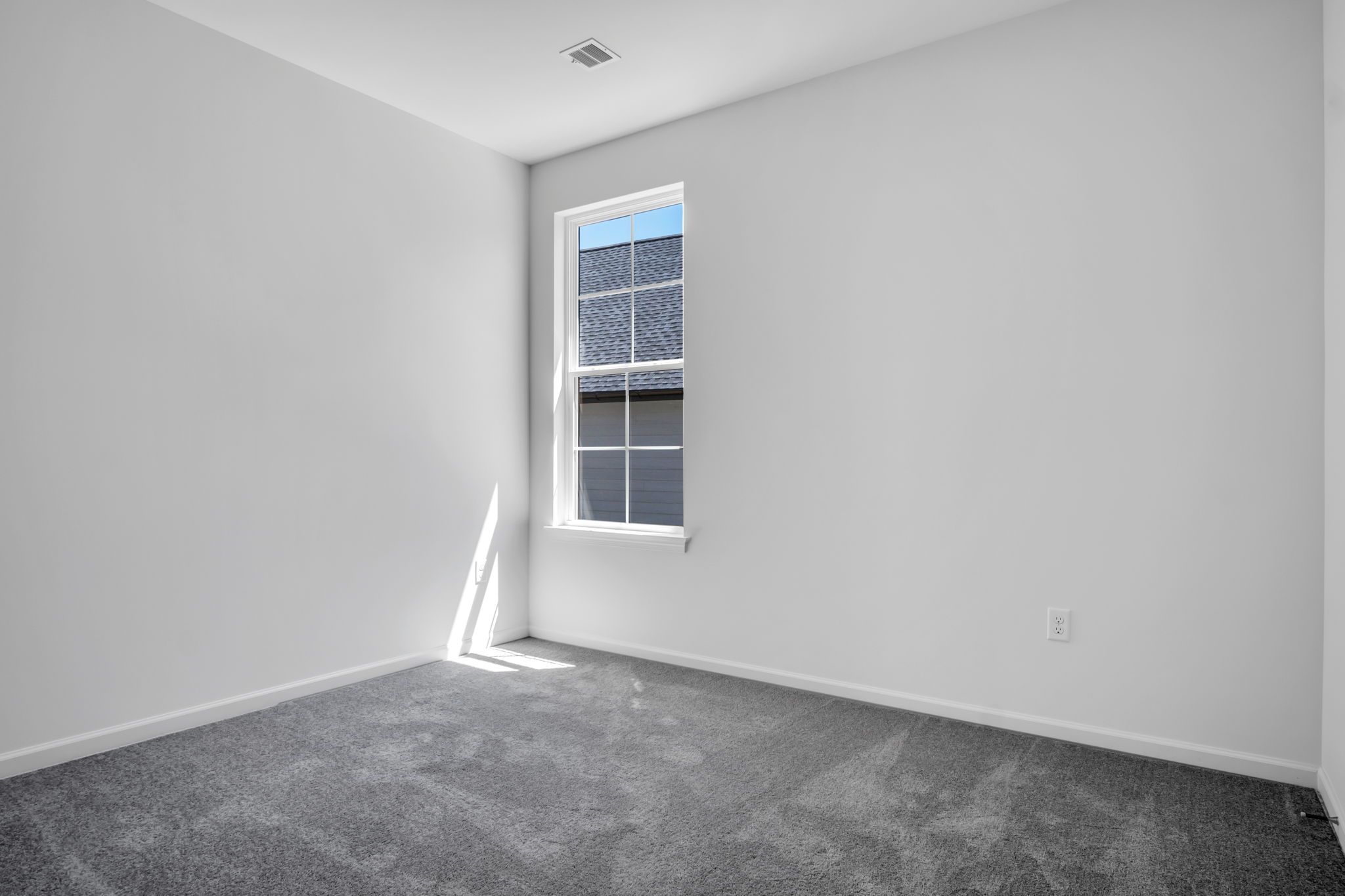 Empty Bedroom of the Tippet Model from Garman Builders