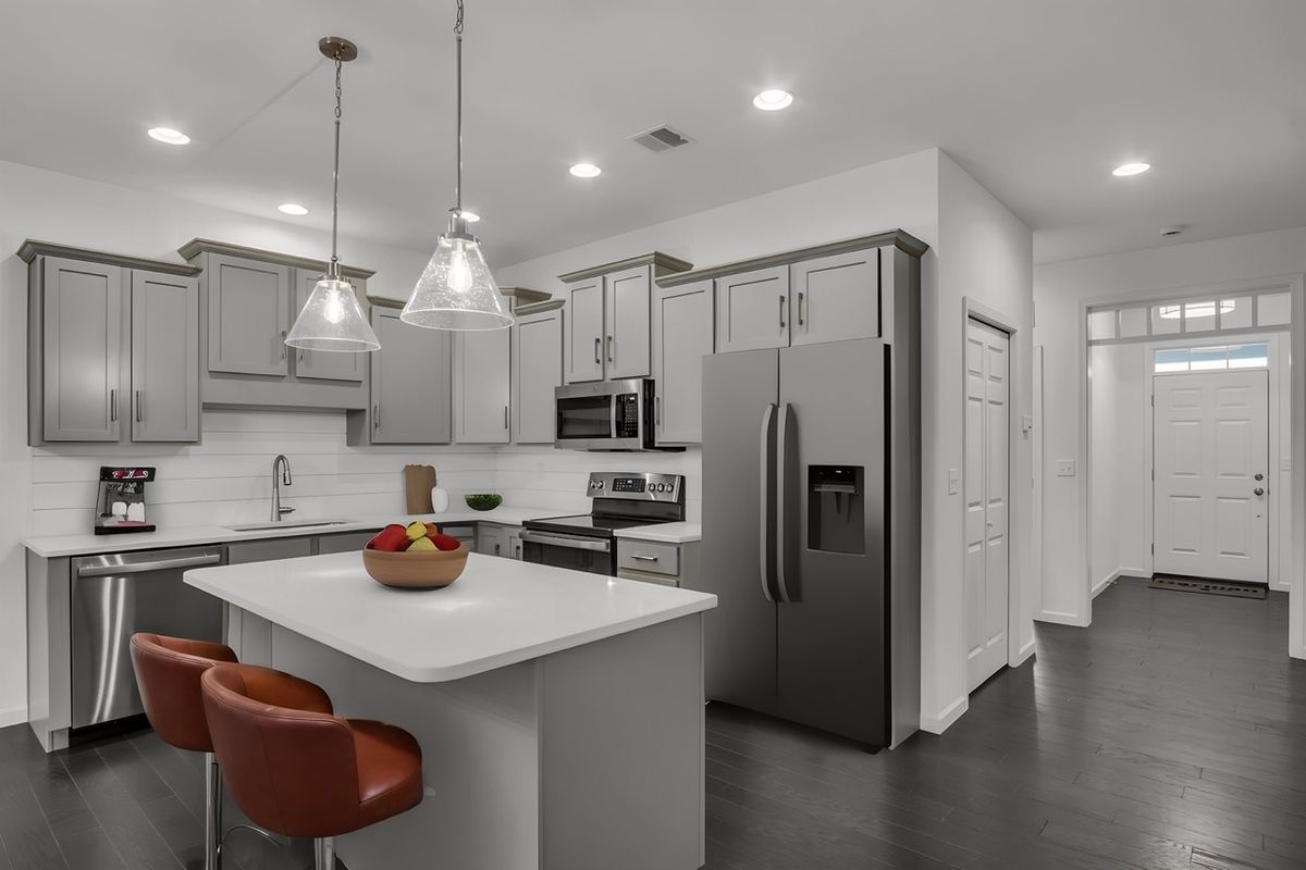 Kitchen with Center Island of the Griffin Model from Garman Builders