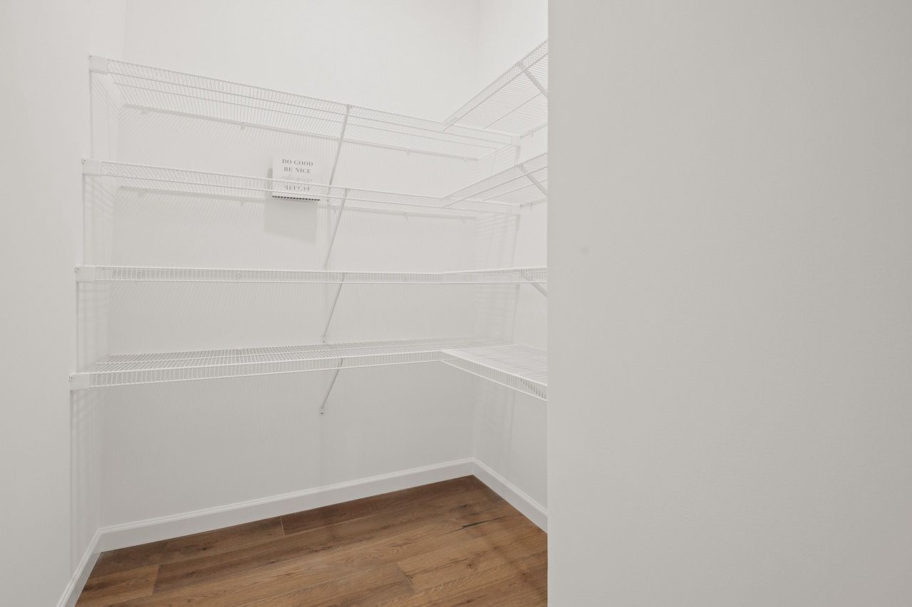 Walk in closet in the Ariel model from Garman Builders