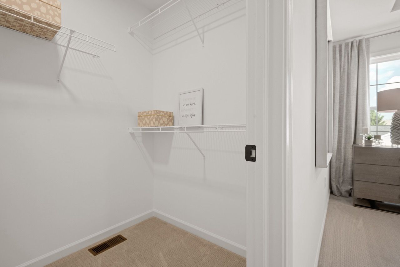 Walk in closet in the Ariel model from Garman Builders