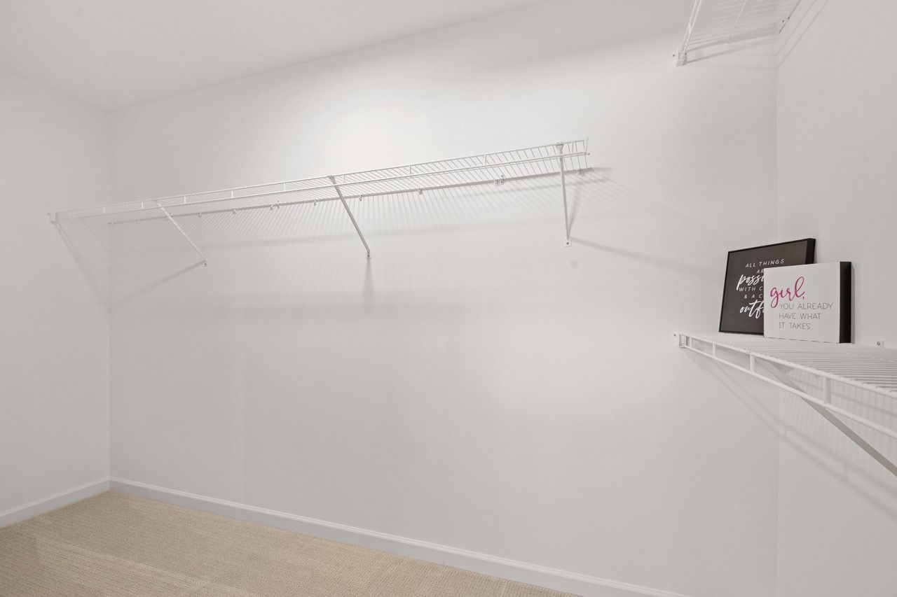 Walk in closet in the Ariel model from Garman Builders