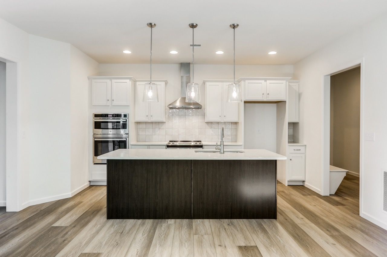 Kitchen with Center Island of the Sloane II Model from Garman Builders