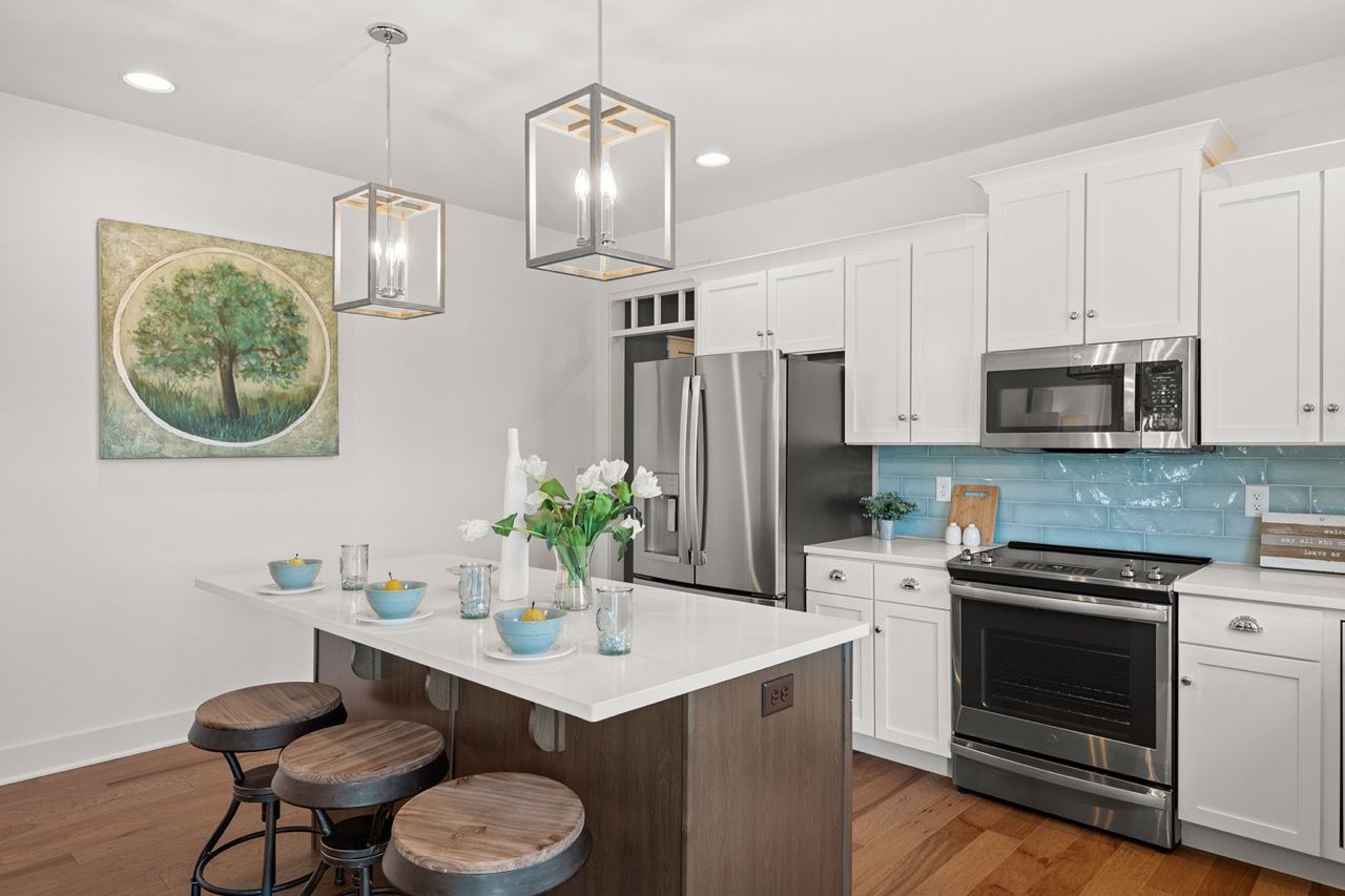 Kitchen with Center Island of the Mackenzie Model from Garman Builders