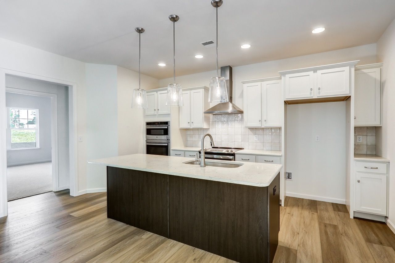 Kitchen with Center Island of the Sloane II Model from Garman Builders