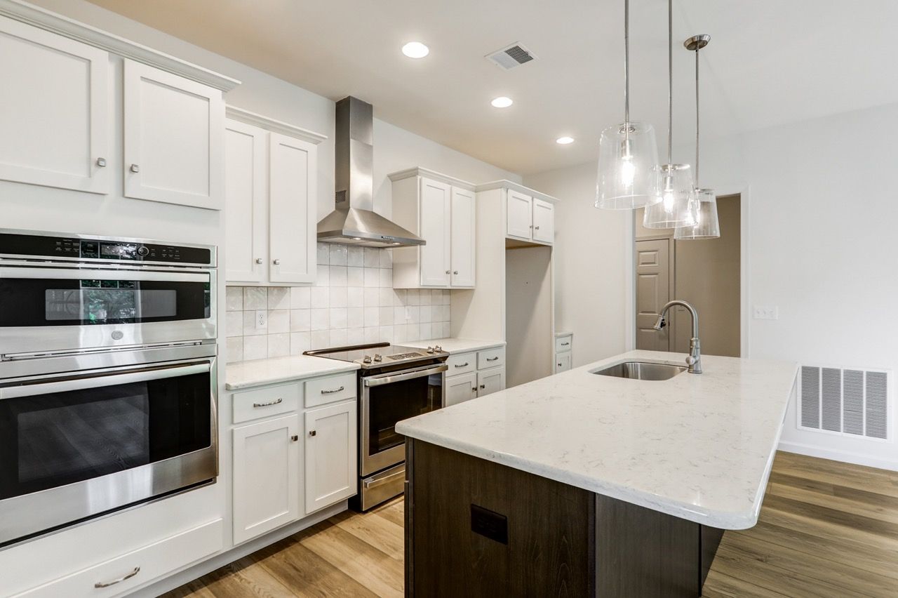 Kitchen with Center Island of the Sloane II Model from Garman Builders