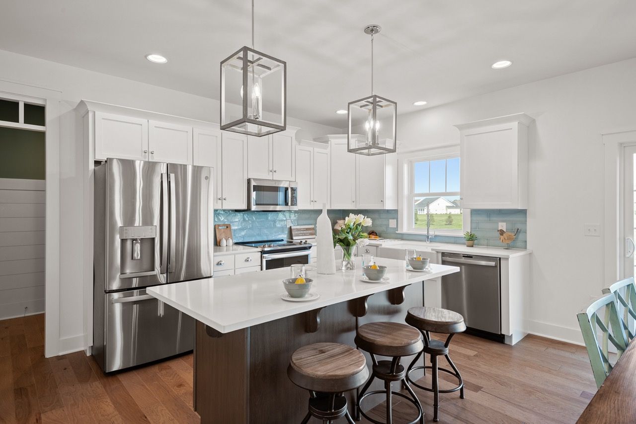 Kitchen with Center Island of the Mackenzie Model from Garman Builders