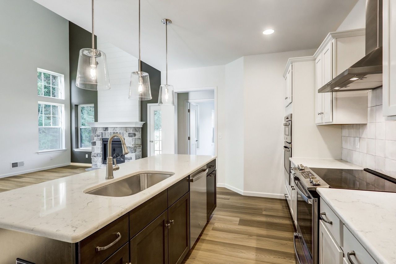 Kitchen with Center Island of the Sloane II Model from Garman Builders