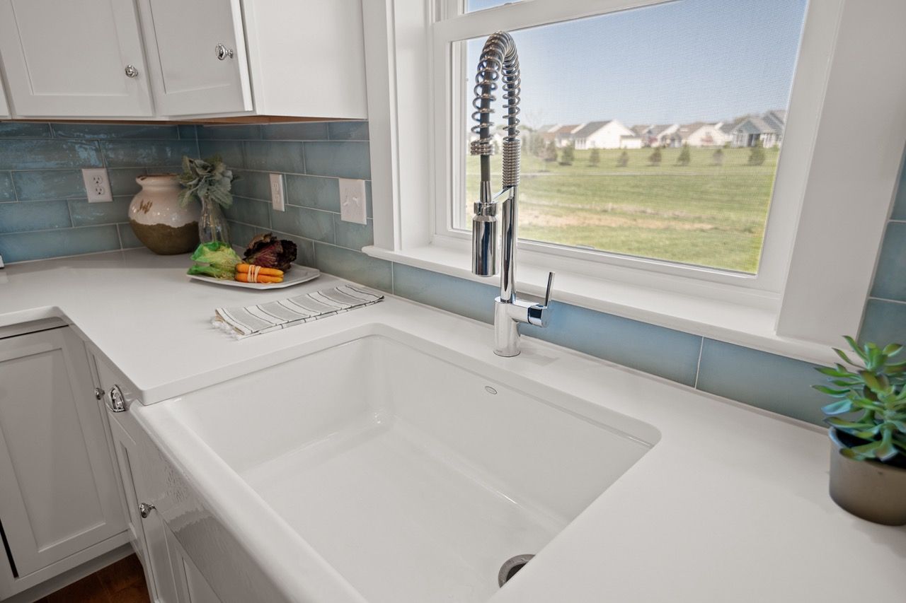 Kitchen with Center Island of the Mackenzie Model from Garman Builders
