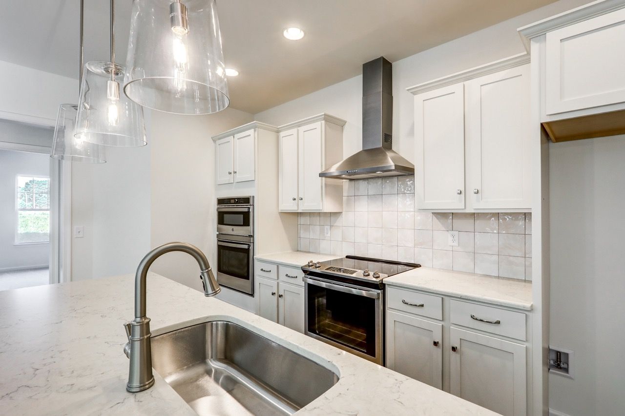Kitchen with Center Island of the Sloane II Model from Garman Builders