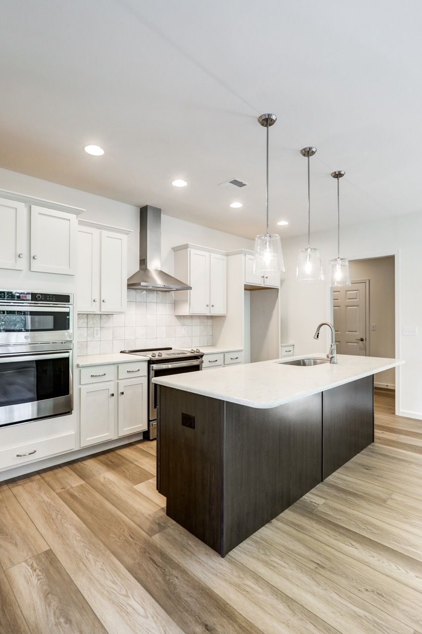 Kitchen with Center Island of the Sloane II Model from Garman Builders