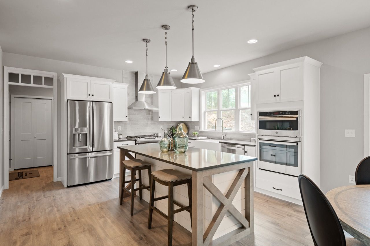 Kitchen with Center Island of the Nottingham Model from Garman Builders
