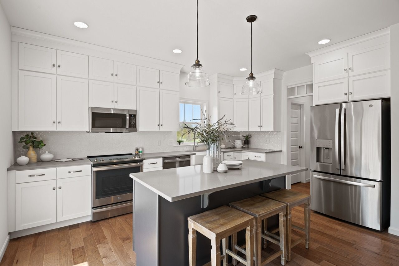 Kitchen with center island of the McKenna Model from Garman Builders