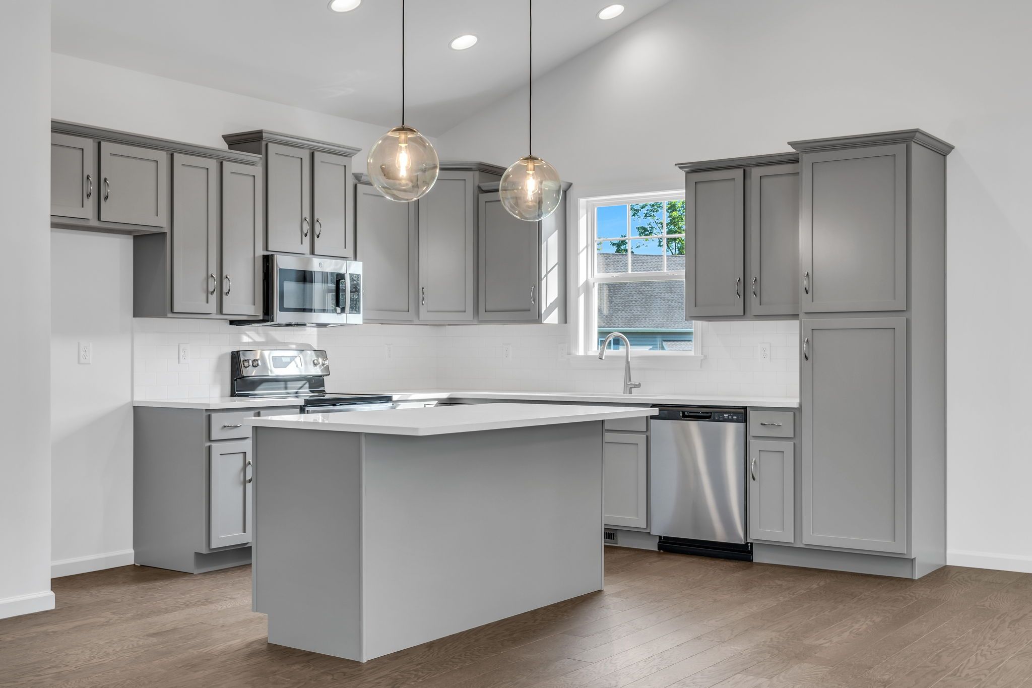 Kitchen with center island of the Dalton Model from Garman Builders