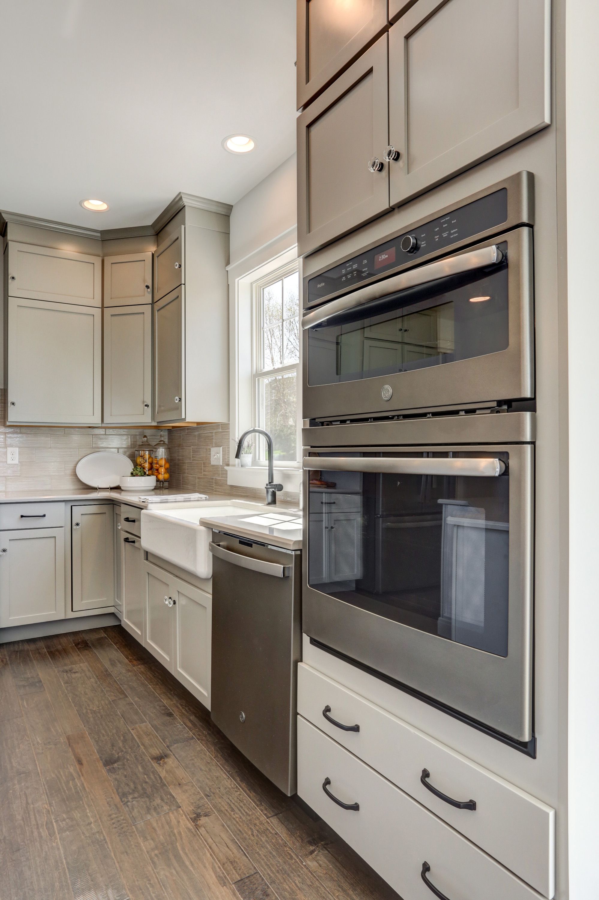 Kitchen with grey cabinets in the Avondale model from Garman Builders