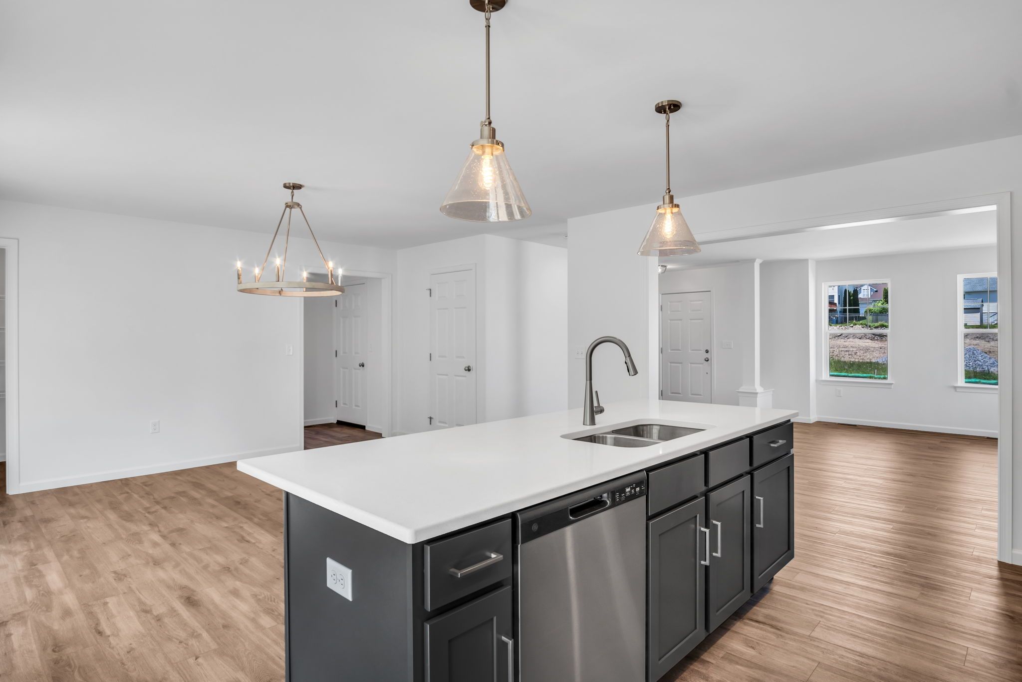 Kitchen with center island of the Charlotte Model from Garman Builders
