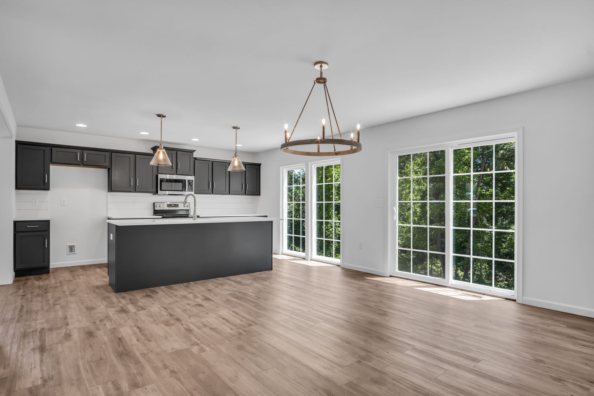 Kitchen with center island of the Charlotte Model from Garman Builders