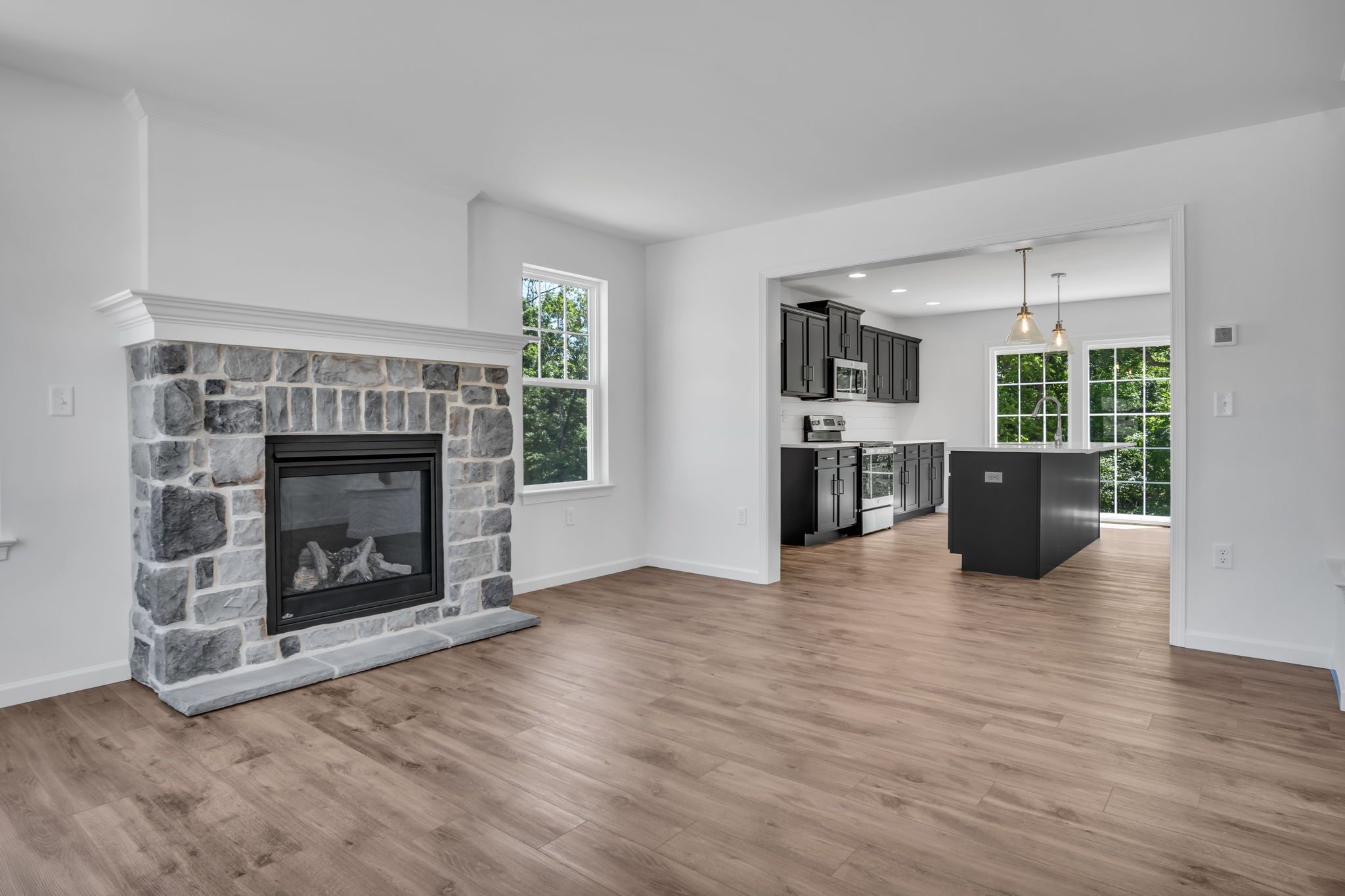 Kitchen with center island of the Charlotte Model from Garman Builders