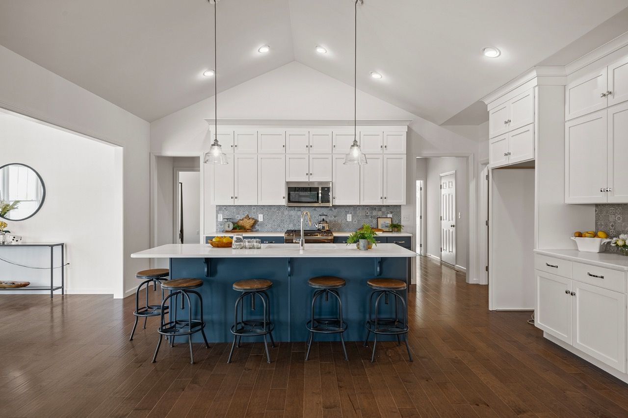 Kitchen with white cabinets of the Blakely model from Garman Builders