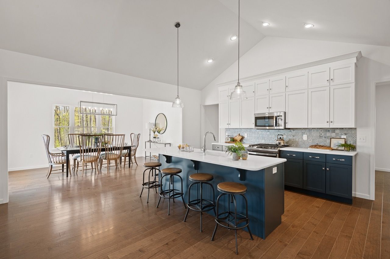 Kitchen with white cabinets of the Blakely model from Garman Builders