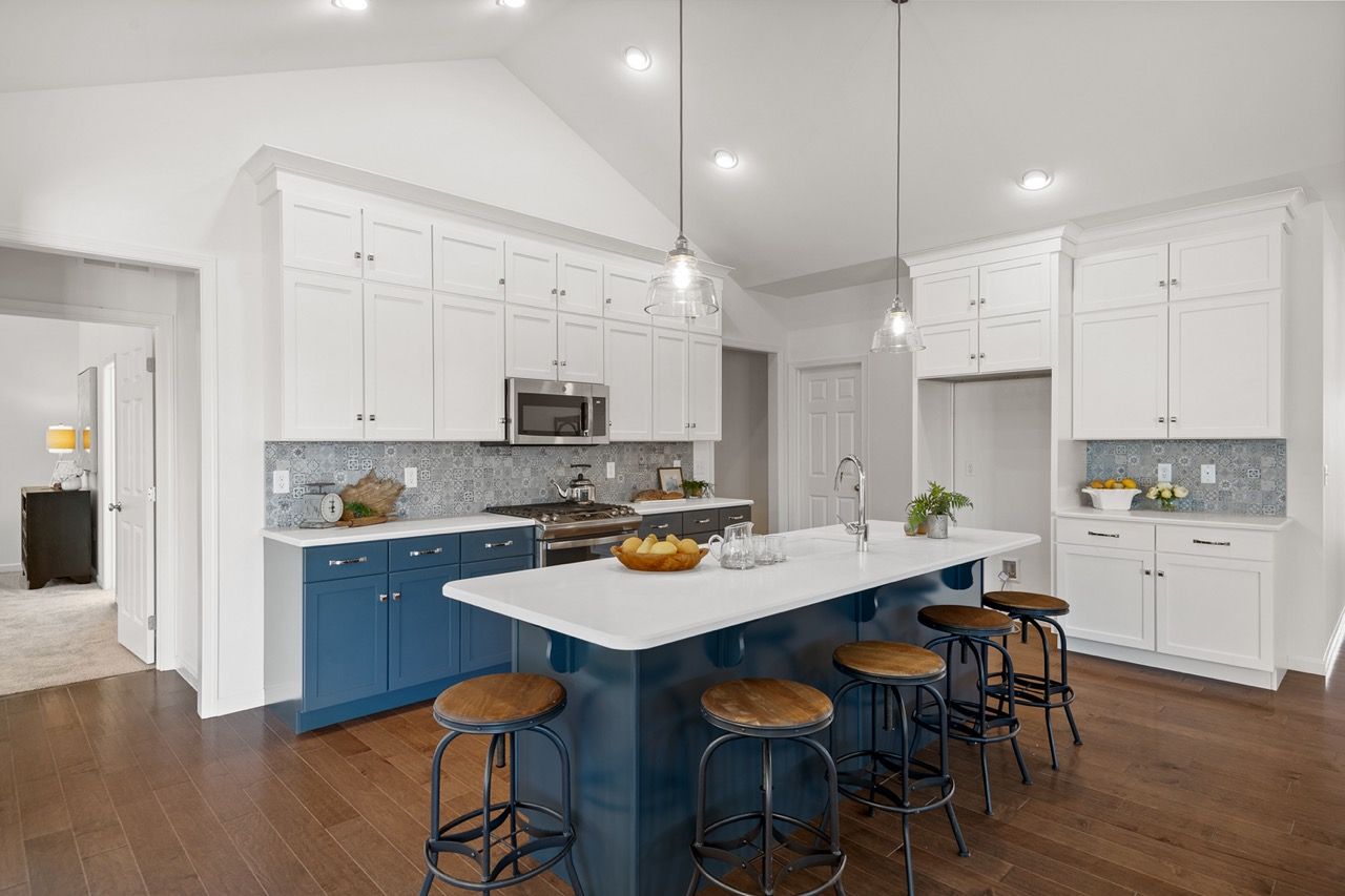 Kitchen with white cabinets of the Blakely model from Garman Builders