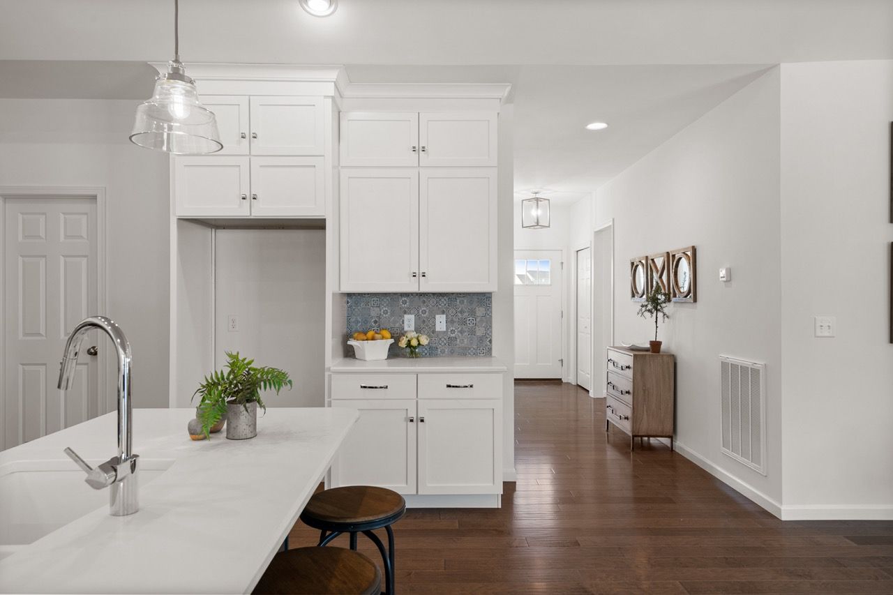 Kitchen with white cabinets of the Blakely model from Garman Builders