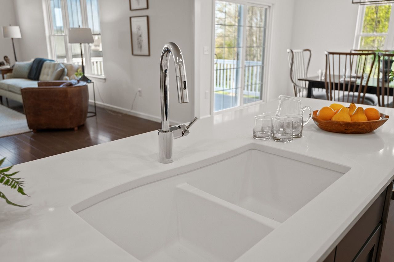 Kitchen with white cabinets of the Blakely model from Garman Builders