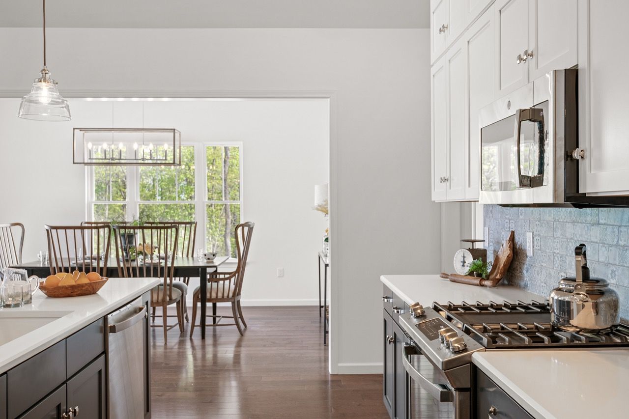 Kitchen with white cabinets of the Blakely model from Garman Builders
