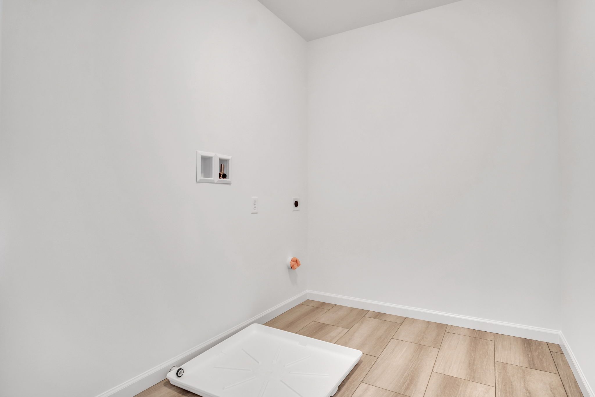 Empty Laundry Room of the Everett Model from Garman Builders