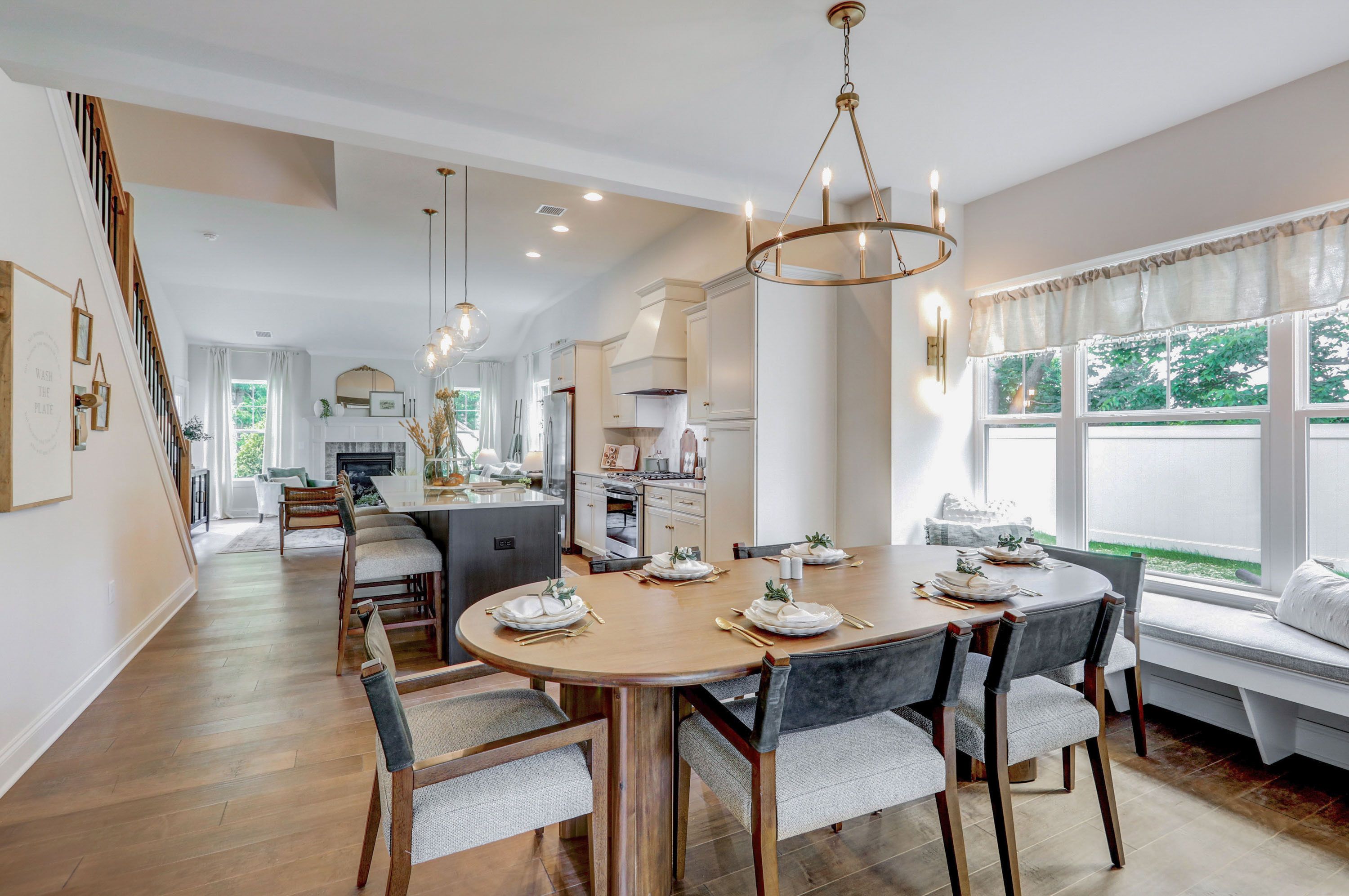 Dining room and kitchen in a home at Wynfield at Millersville