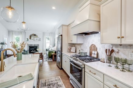 Kitchen with white cabinets in a home at Wynfield at Millersville