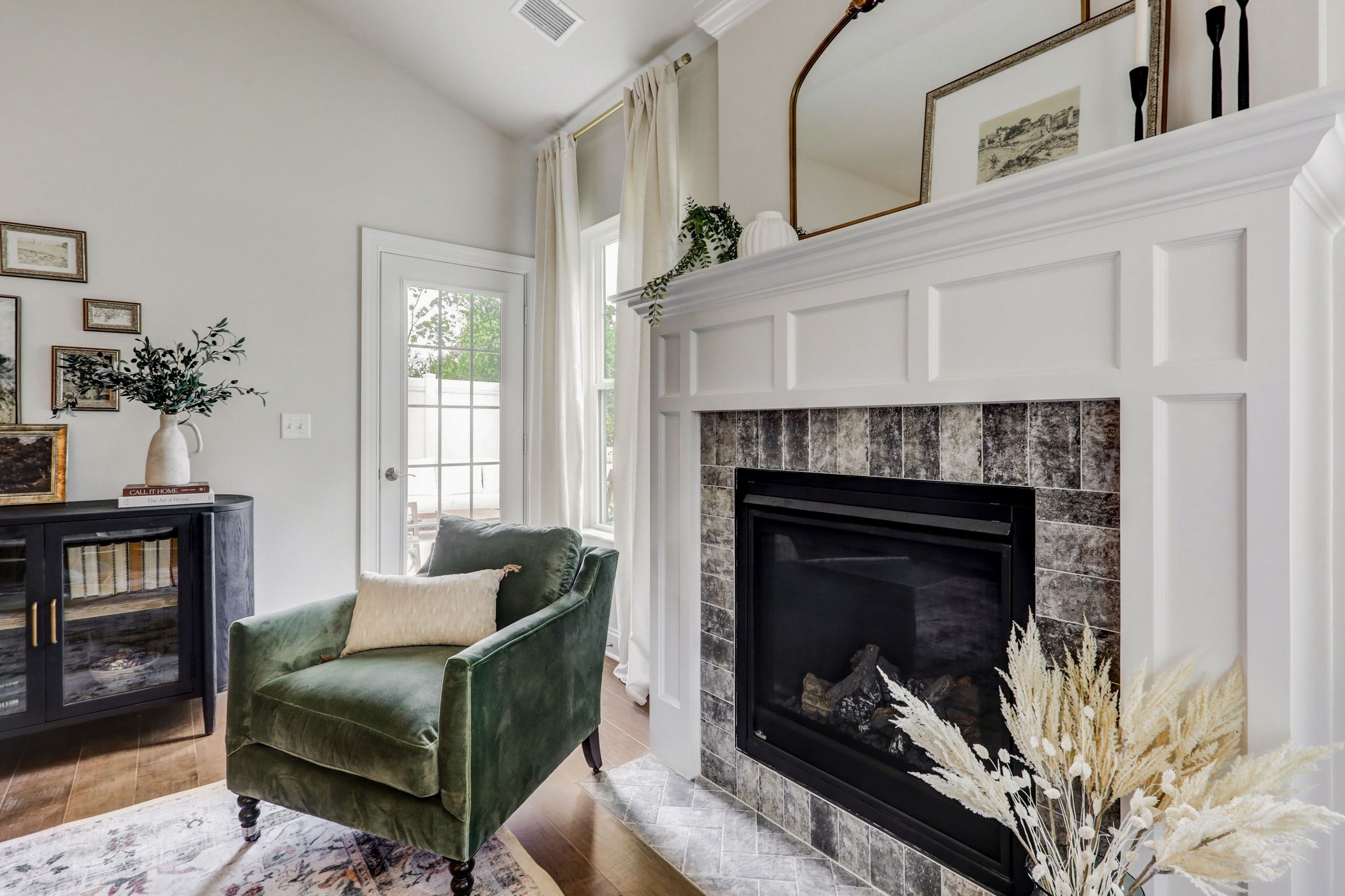 Living room with fireplace in a home at Wynfield at Millersville