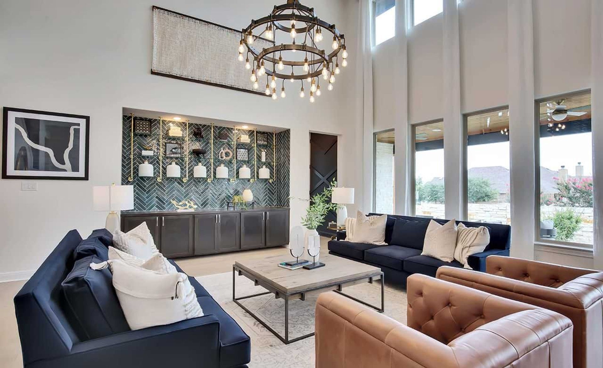 Stunning high ceilings and a modern chandelier define this Oaks at San Gabriel masterpiece in Georgetown.