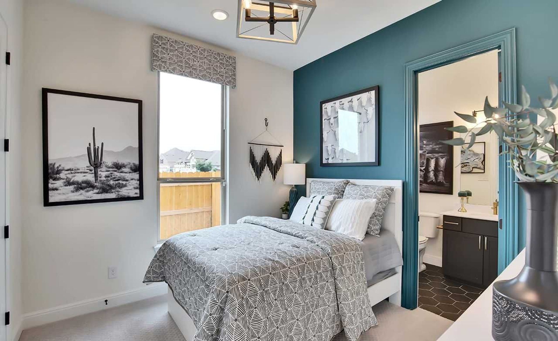 Experience refined elegance with a teal accent wall and geometric fixtures in San Gabriel.