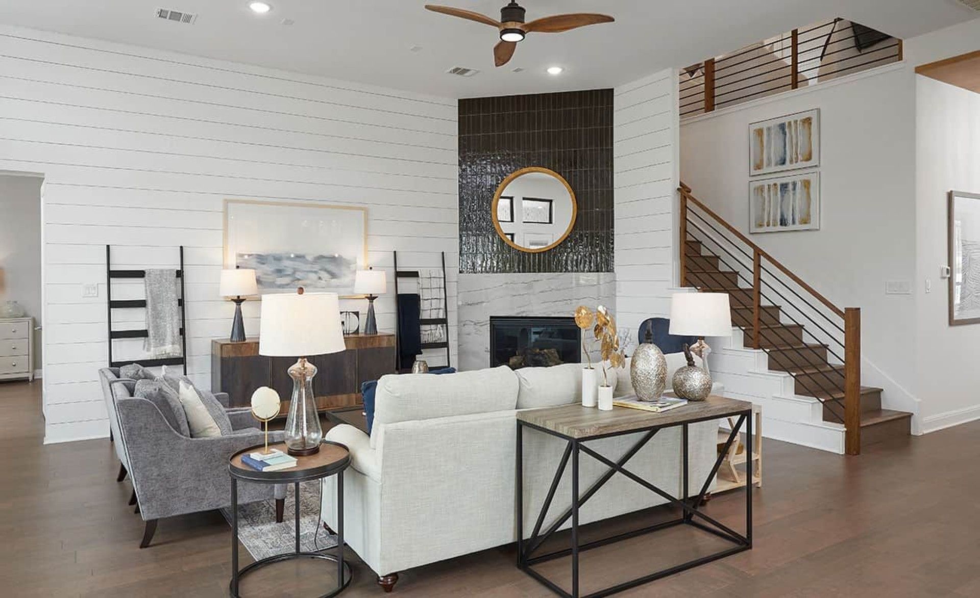 Experience refined luxury with shiplap walls, sophisticated lighting, and a mesmerizing fireplace in Anthem.