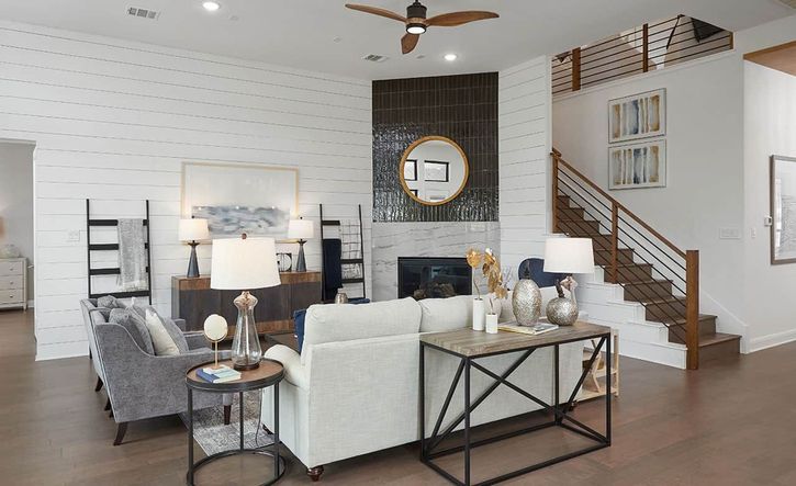 Experience refined luxury with shiplap walls, sophisticated lighting, and a mesmerizing fireplace in Anthem.
