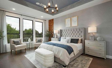 Discover sophistication with a tufted headboard, chic lighting, and expansive windows in Anthem.