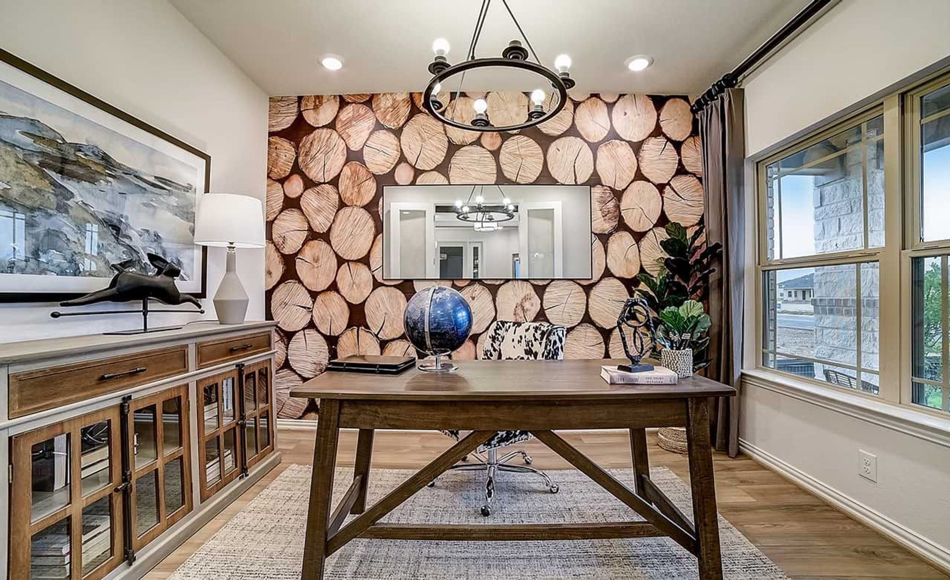 Exquisite home office with chic log-patterned feature wall and refined wooden desk in Dauer Ranch.