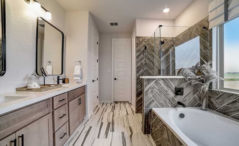 Exquisite herringbone tile contrasts with sleek cabinetry. Scenic views enhance Dauer Ranch's luxurious ambience.