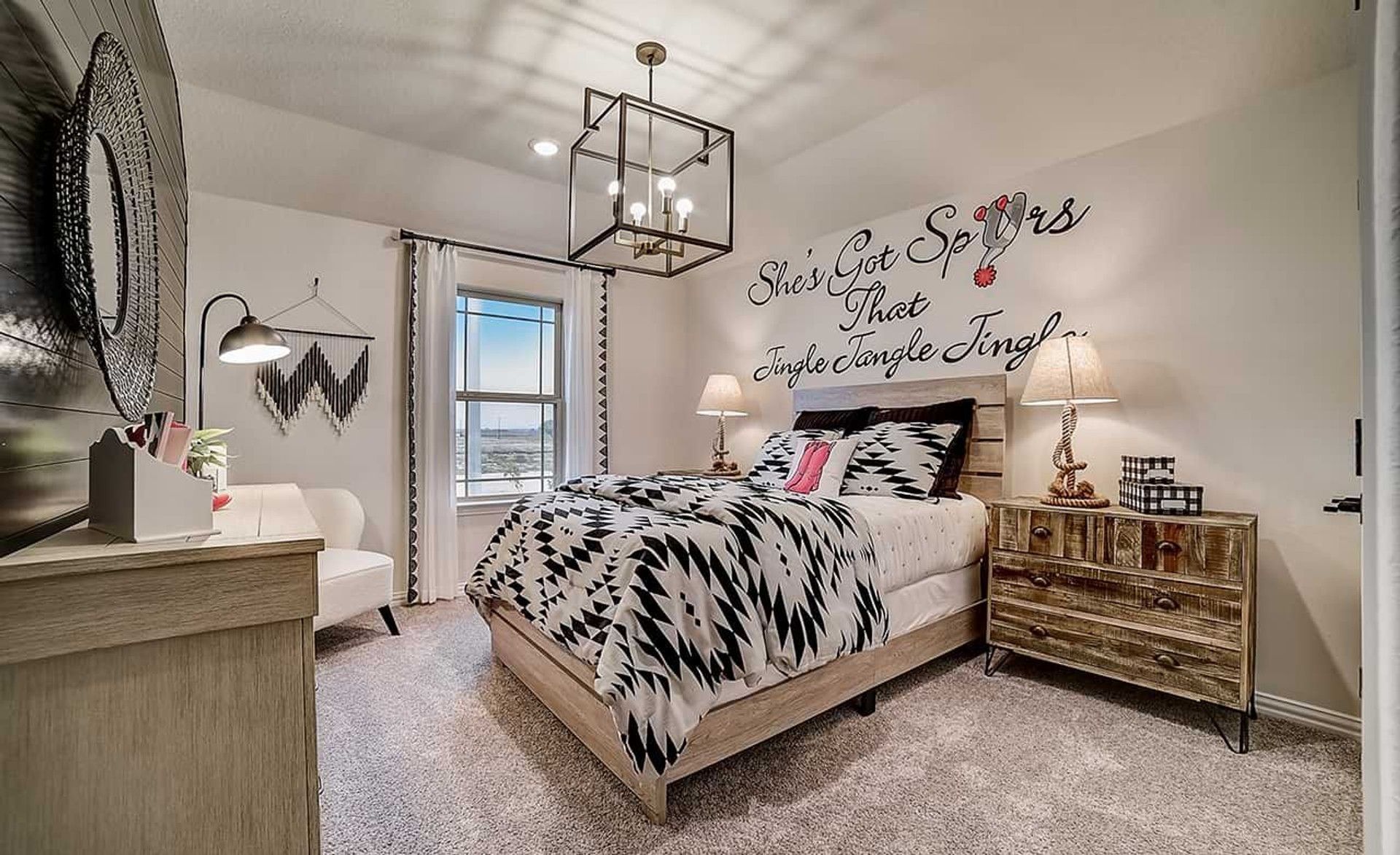 Featuring exquisite geometric decor and rustic wood elements in Dauer Ranch home's elegant bedroom.