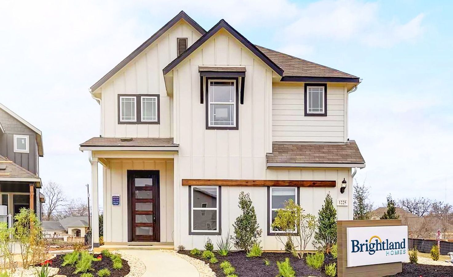 Elegant modern home with a gabled roof and sleek facade in New Braunfels, Texas’s exclusive Casinas at Gruene community.