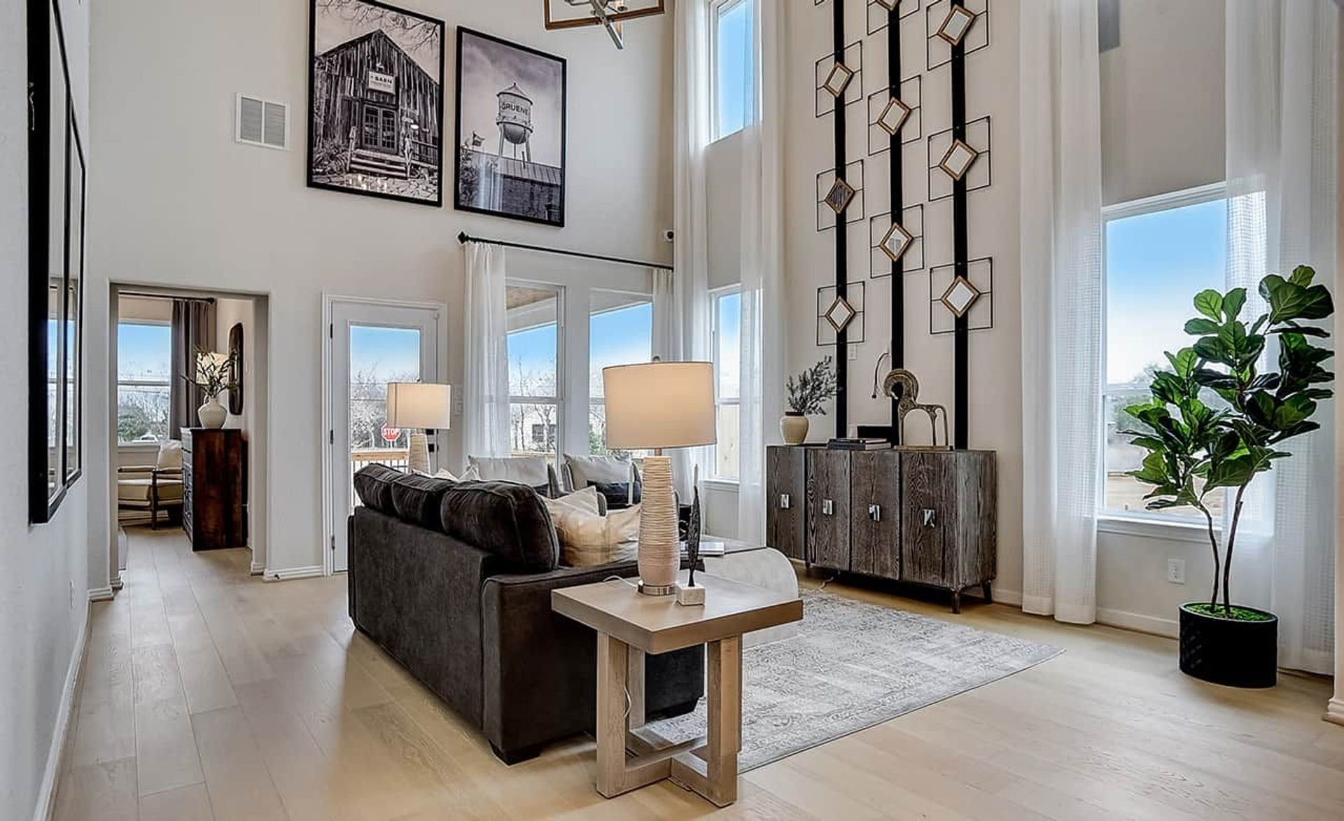 Soaring ceilings and expansive windows define this upscale Gruene living space.