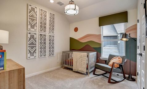 Elegant nursery showcases intricate geometric art, custom mural, and luxe lighting in Casinas at Gruene.