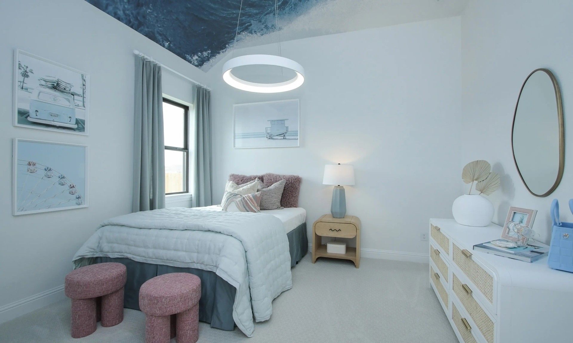 Experience serene elegance in this Coastal Point bedroom, featuring a stunning ocean ceiling and plush, modern furnishings.