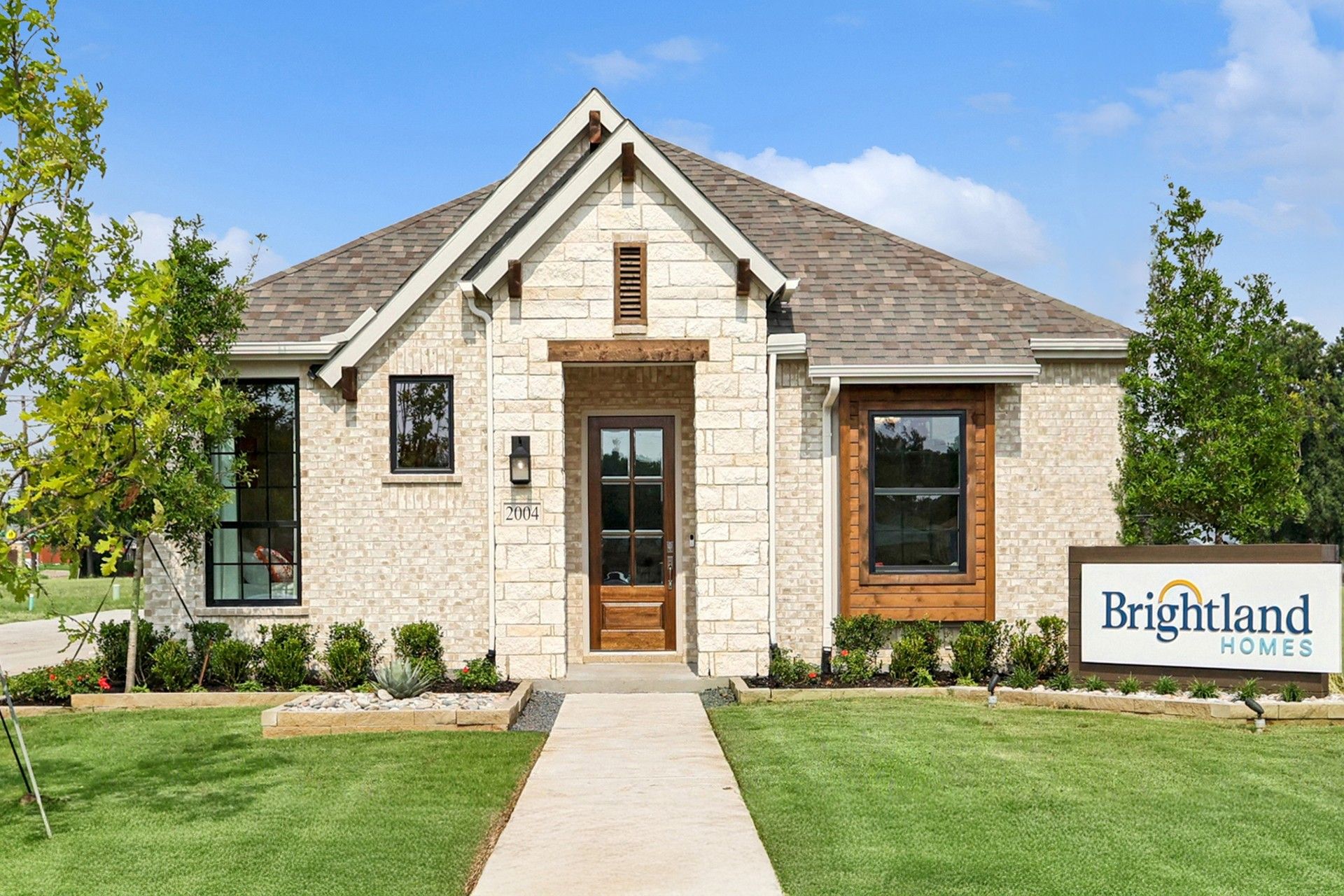 Exquisite stone facade and gabled roof highlight this Heritage Park home’s elegance.